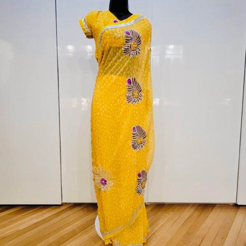 Yellow Saree with Purple motifs
